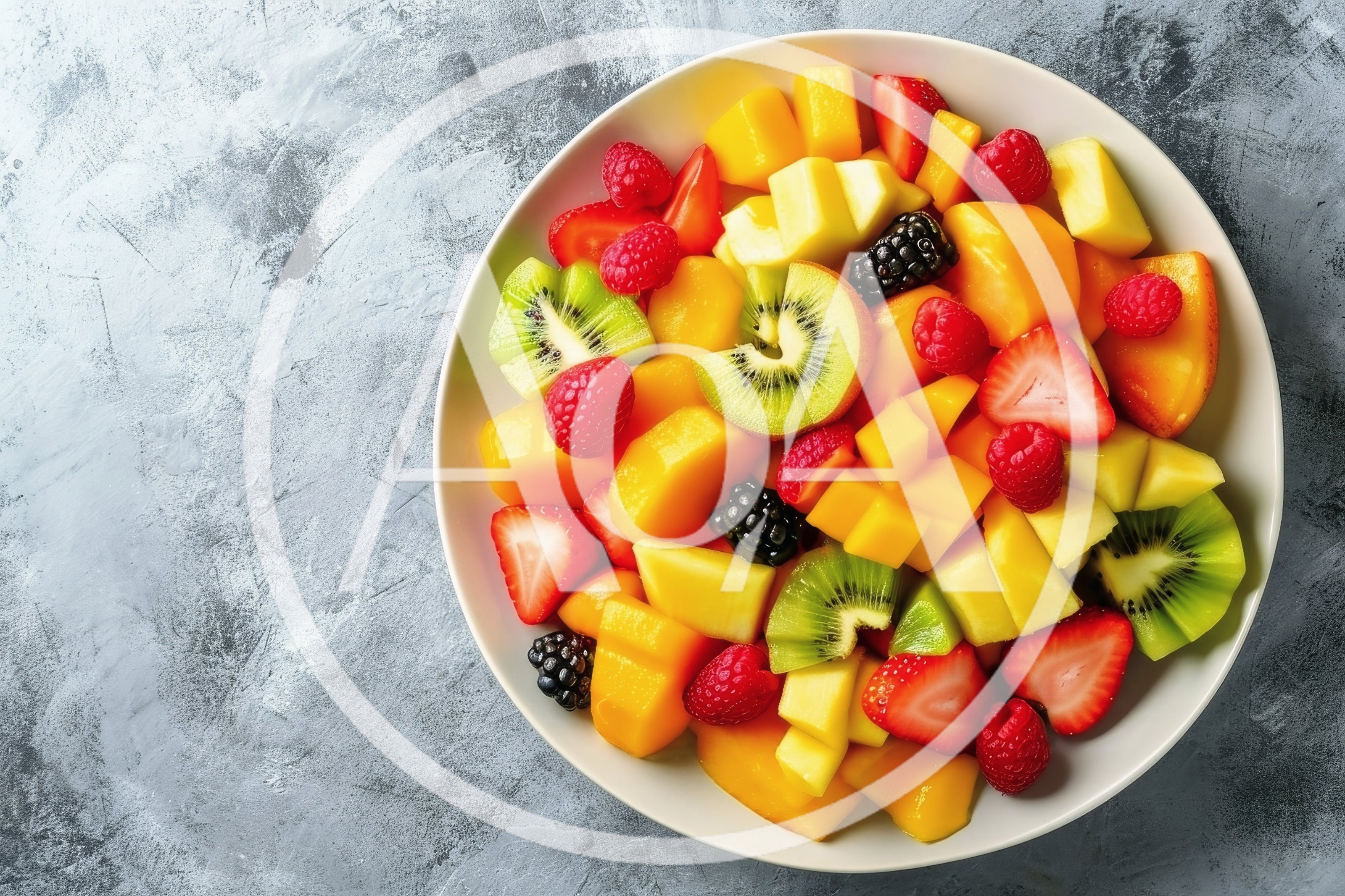 Fresh Fruit Salad Bowl on Textured Gray Background