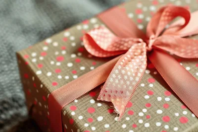 Gift Box Wrapped In Polka Dot Paper With Ribbon