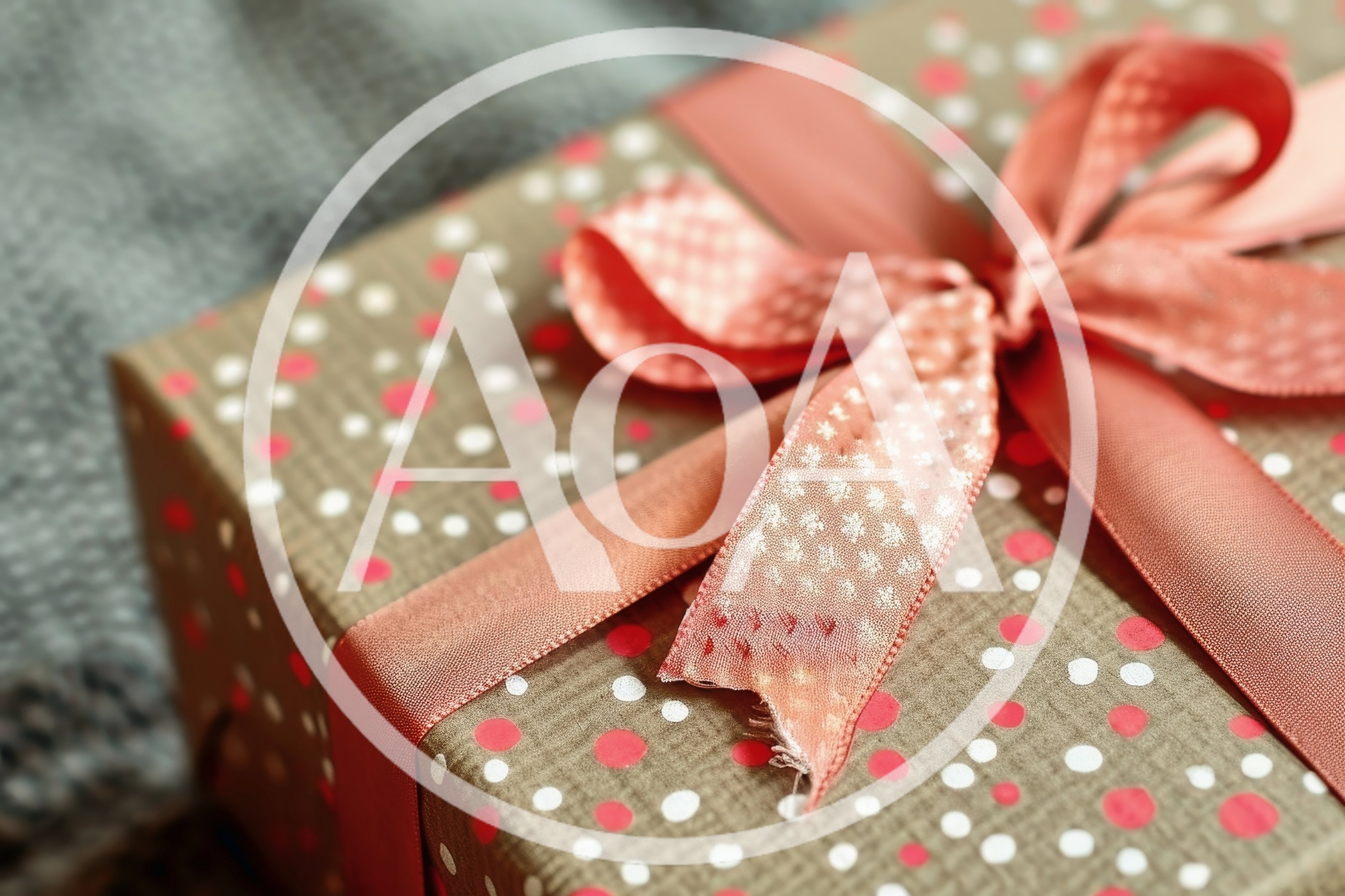 Gift Box Wrapped In Polka Dot Paper With Ribbon