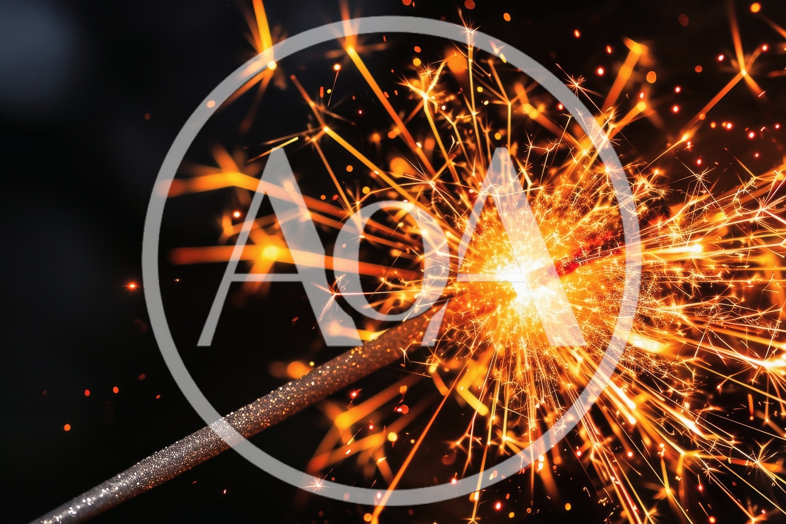 Bright Burning Sparkler Against Dark Background