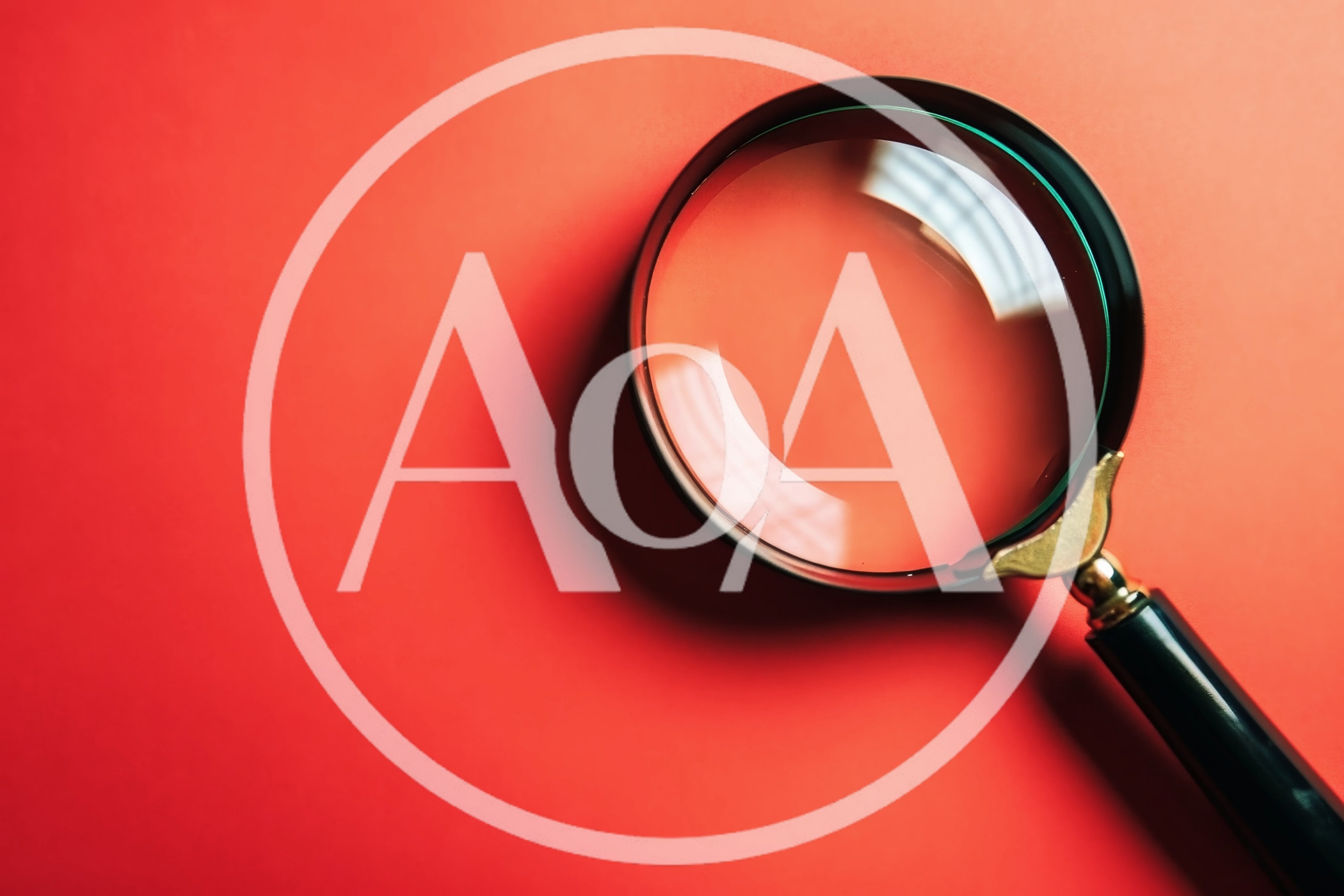 Magnifying Glass Resting On A Vibrant Red Background
