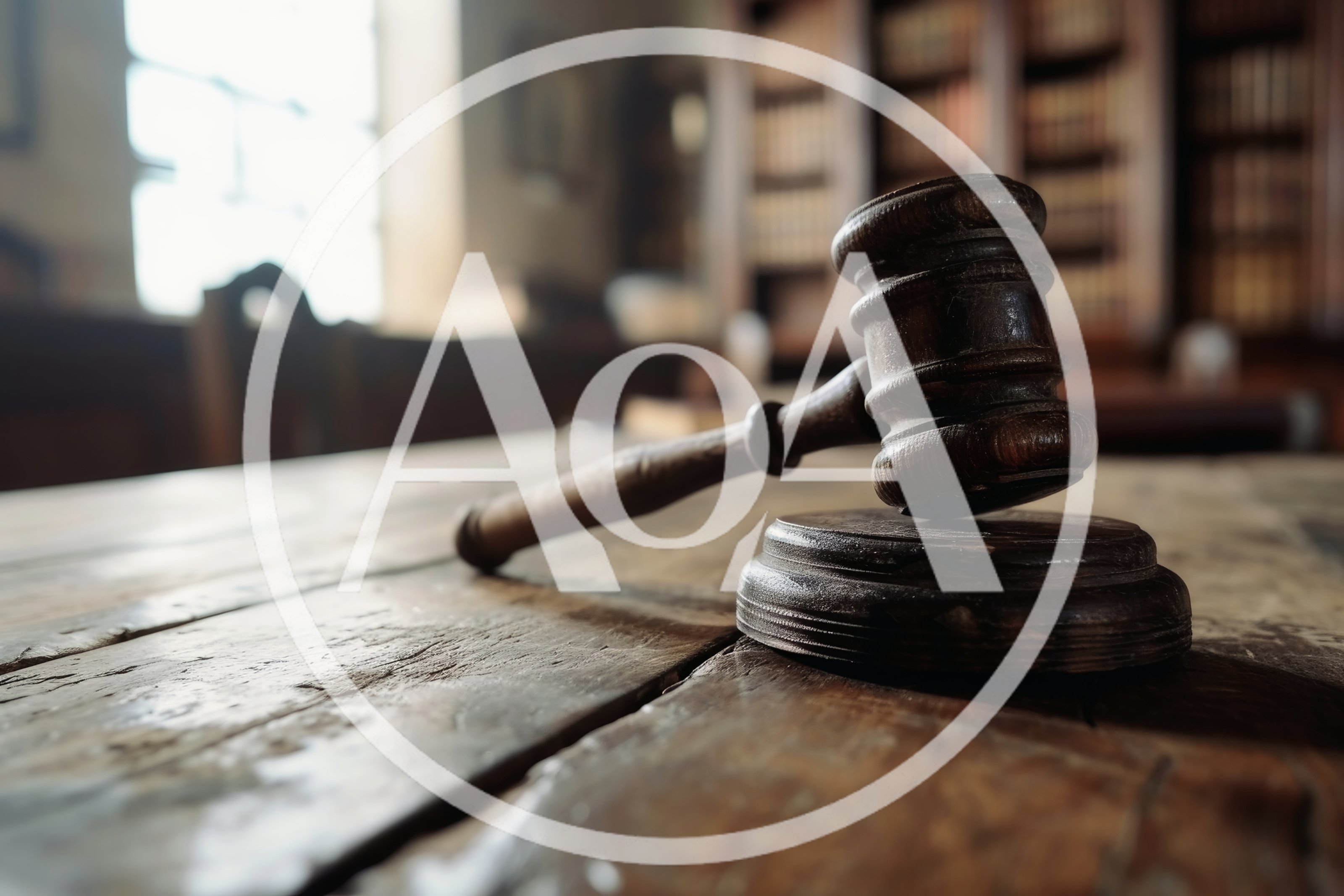 Wooden Judge Gavel Resting On A Courtroom Table