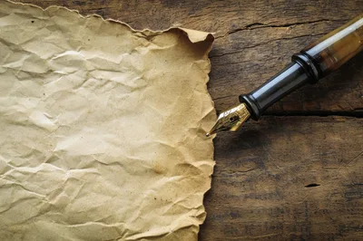 Fountain Pen Resting On Crumpled Vintage Paper