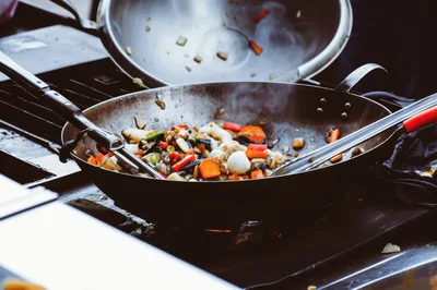 Stir-Frying Fresh Vegetables In A Large Wok