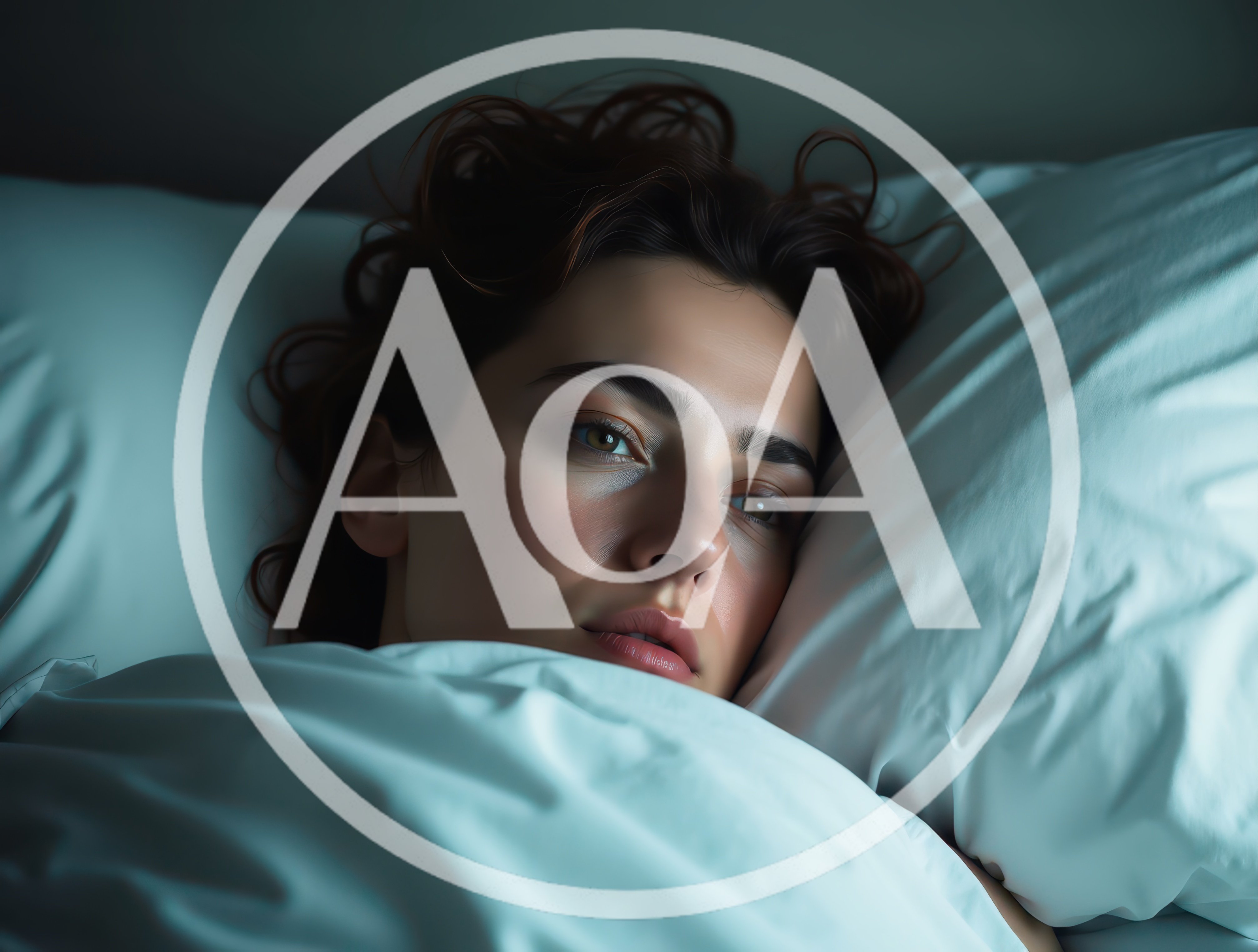 Young Woman Lying Awake In Bed At Night