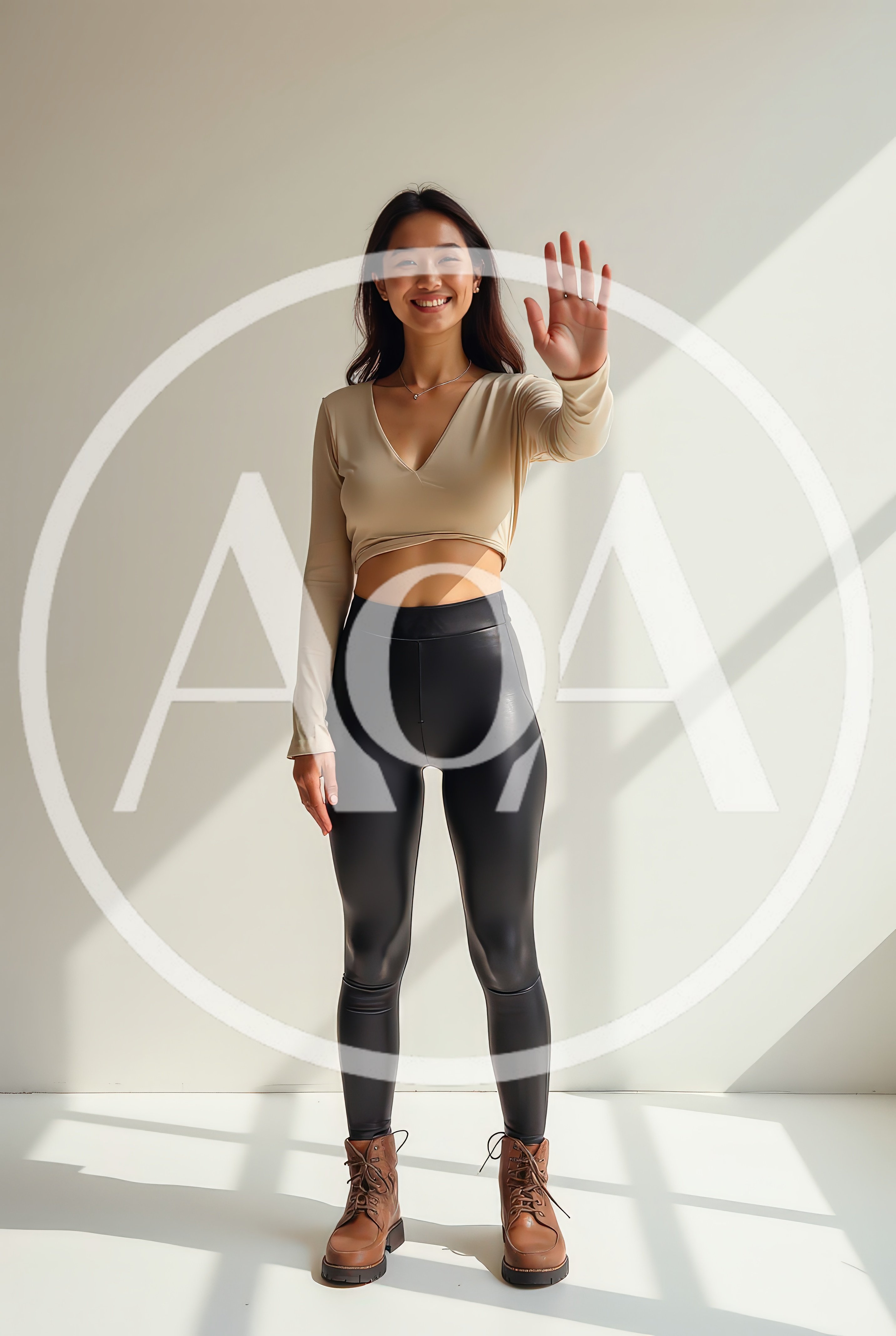 Young Asian Woman Waving Hand In Studio