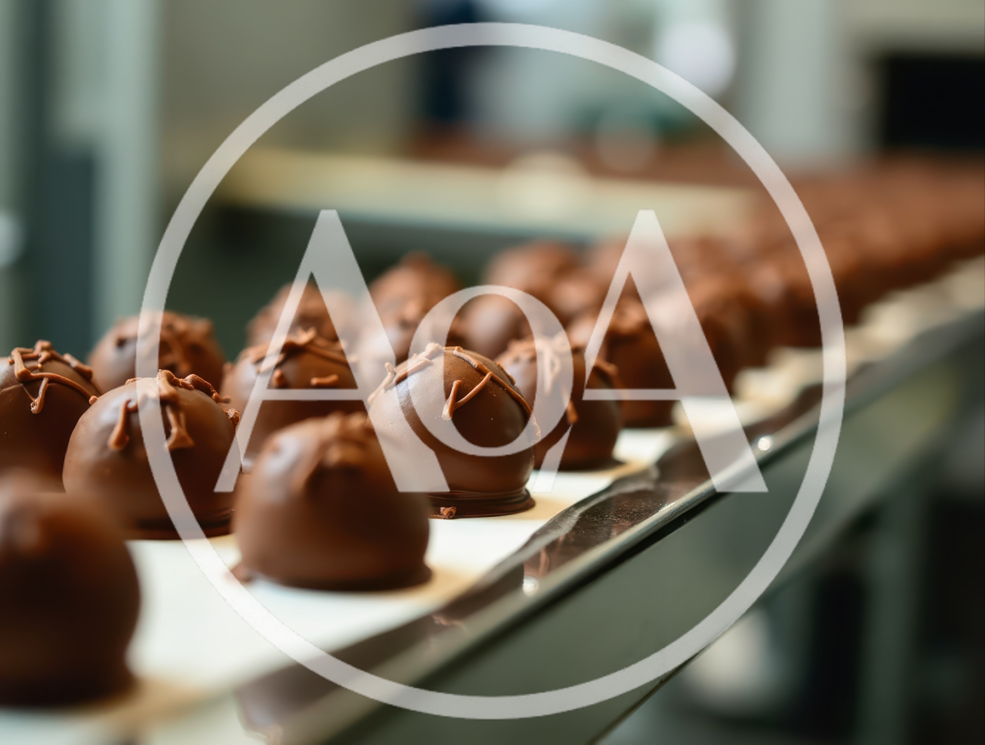 Chocolate Truffles Moving Along A Factory Conveyor Belt