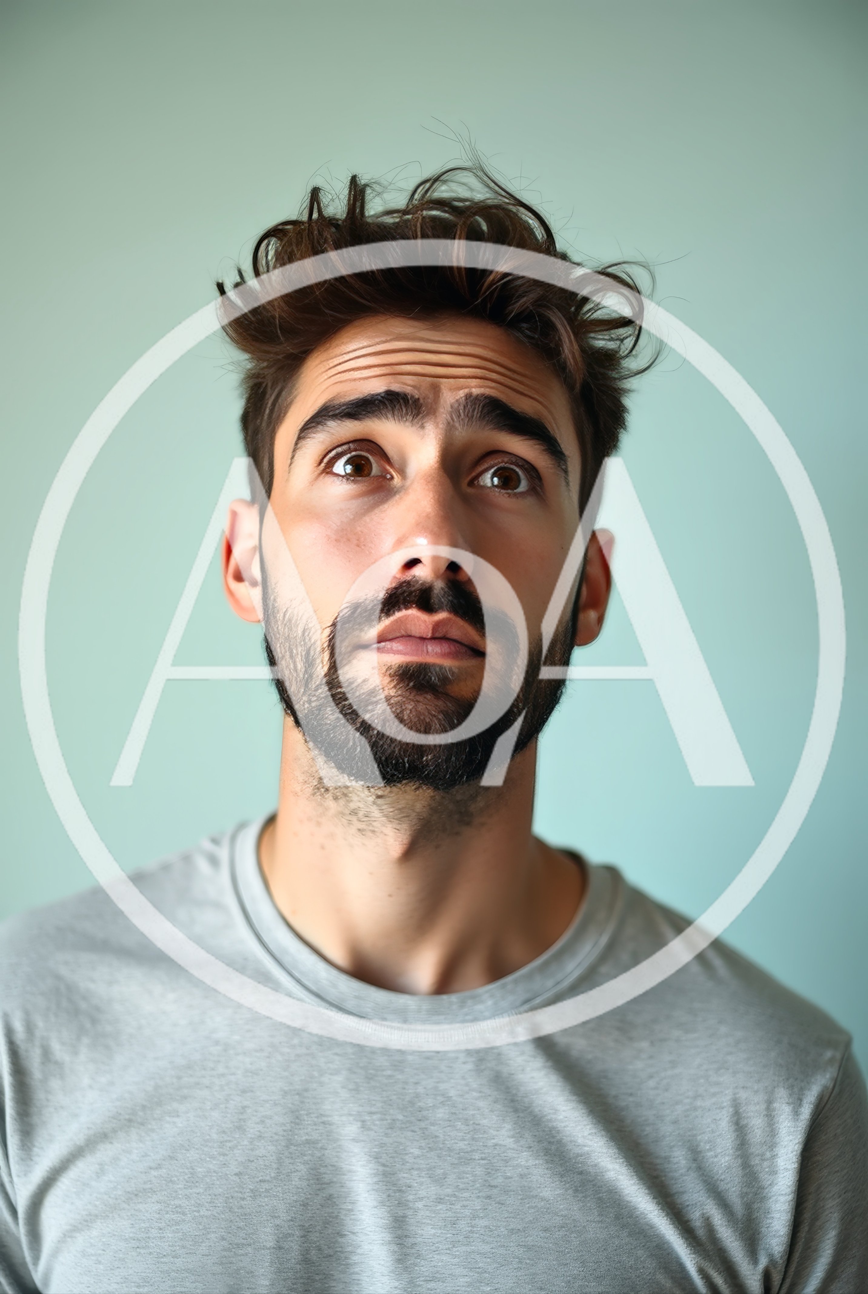 Portrait Of A Confused Young Man Looking Up
