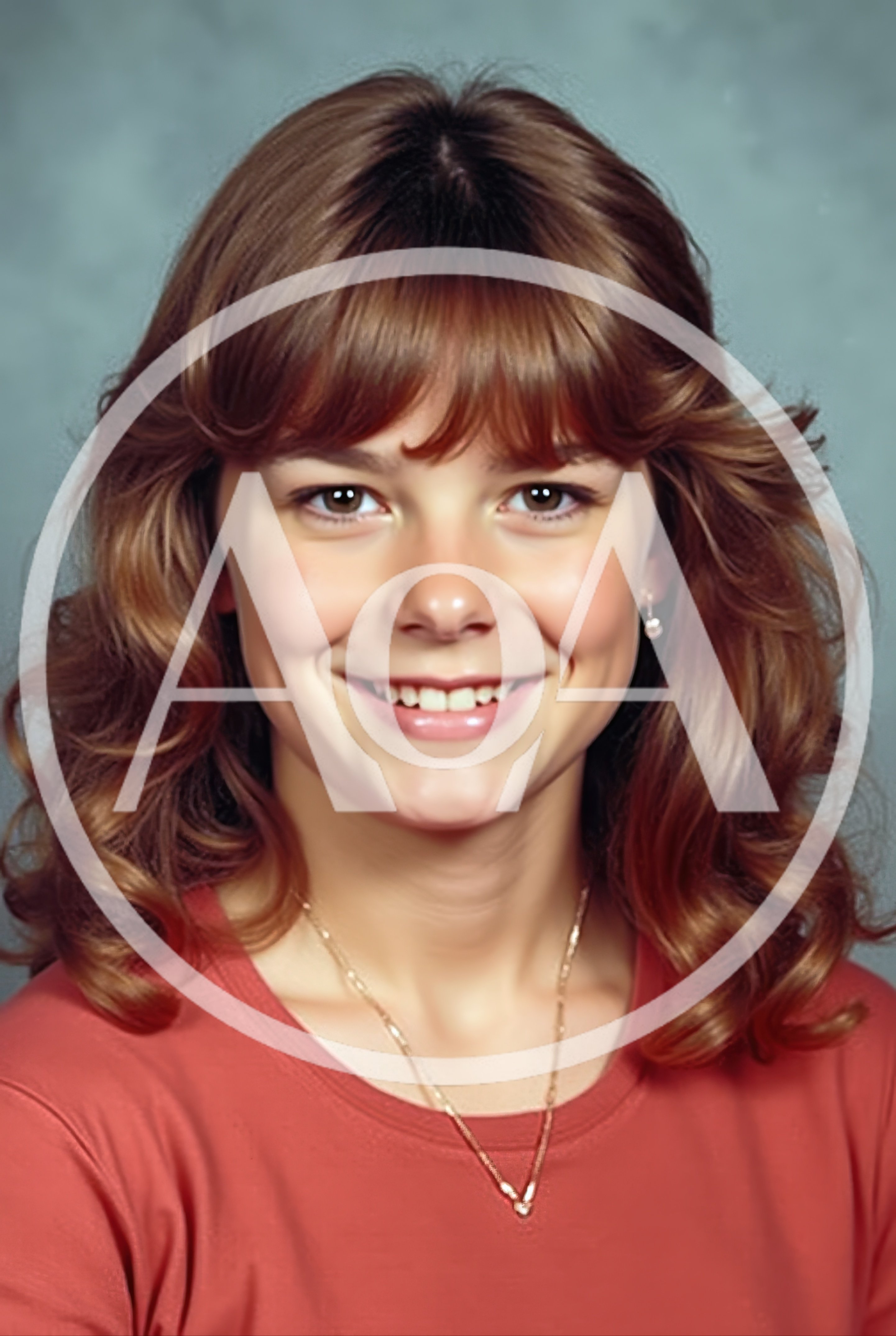 Portrait Of A Smiling Young Woman With Brown Hair