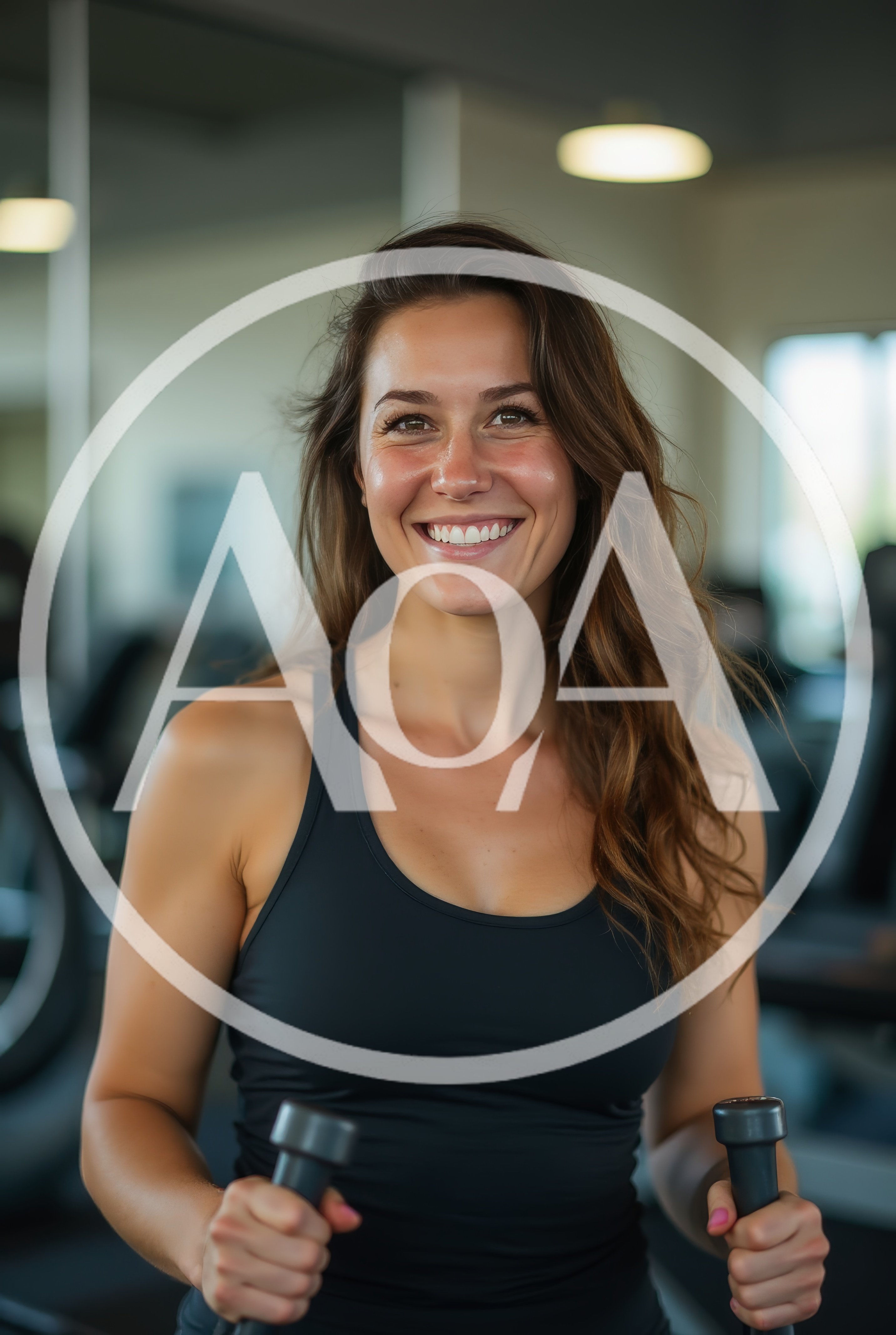 Smiling Woman Exercising On Elliptical Machine In Gym