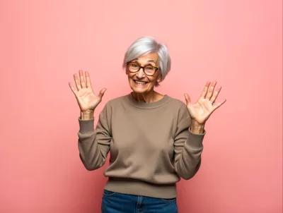 Happy Senior Woman Waving Hands Against Pink Background