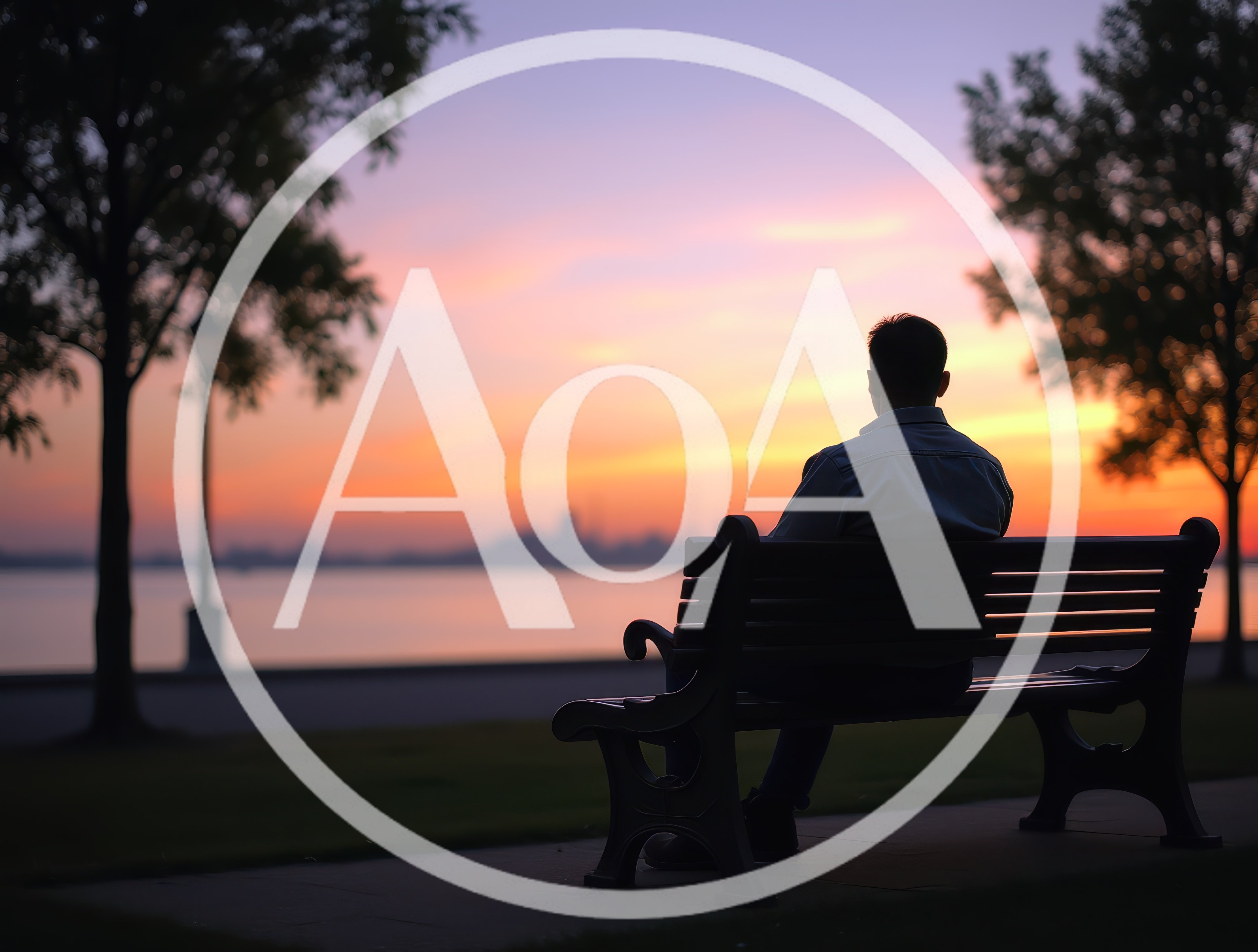 Man Sitting Alone On Park Bench At Sunset
