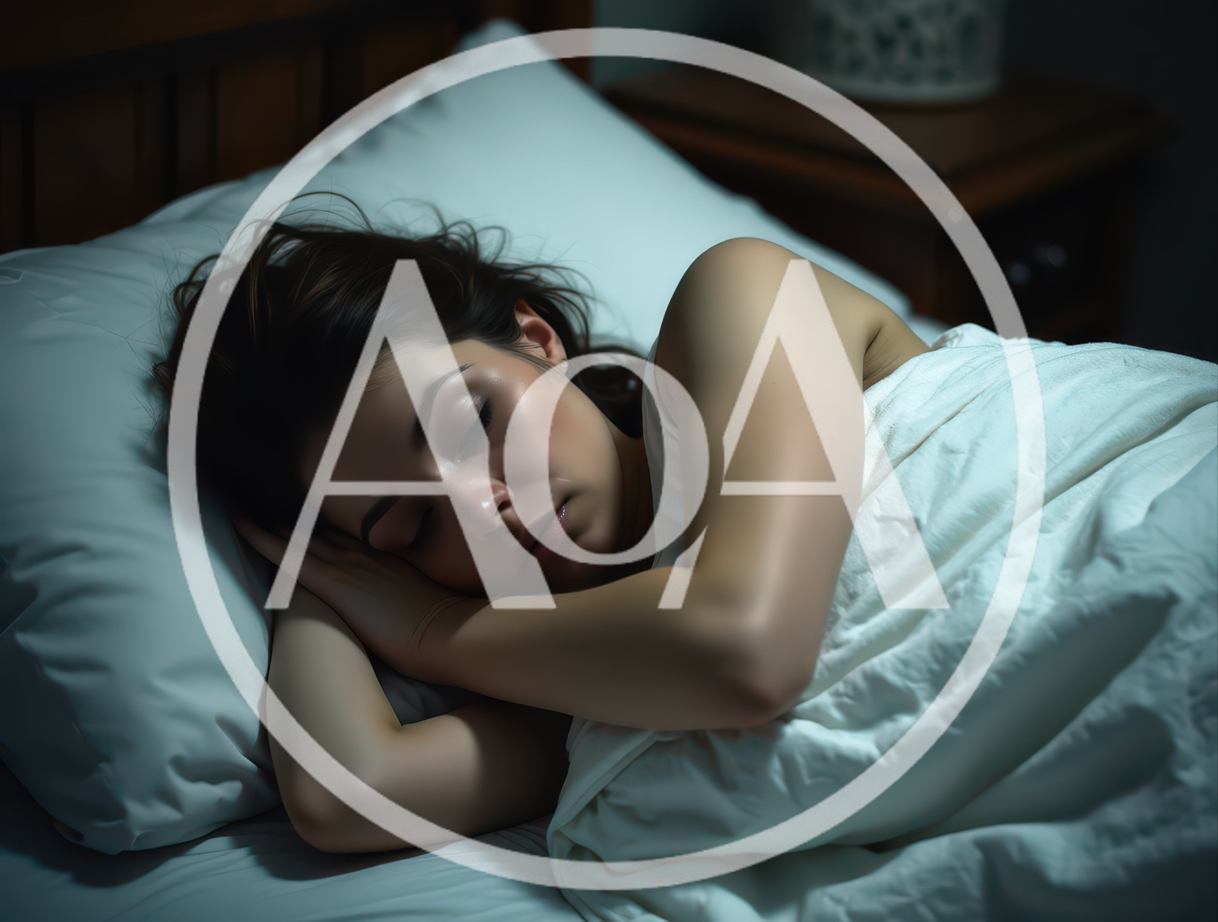 Young Woman Sleeping Peacefully In Bed At Night