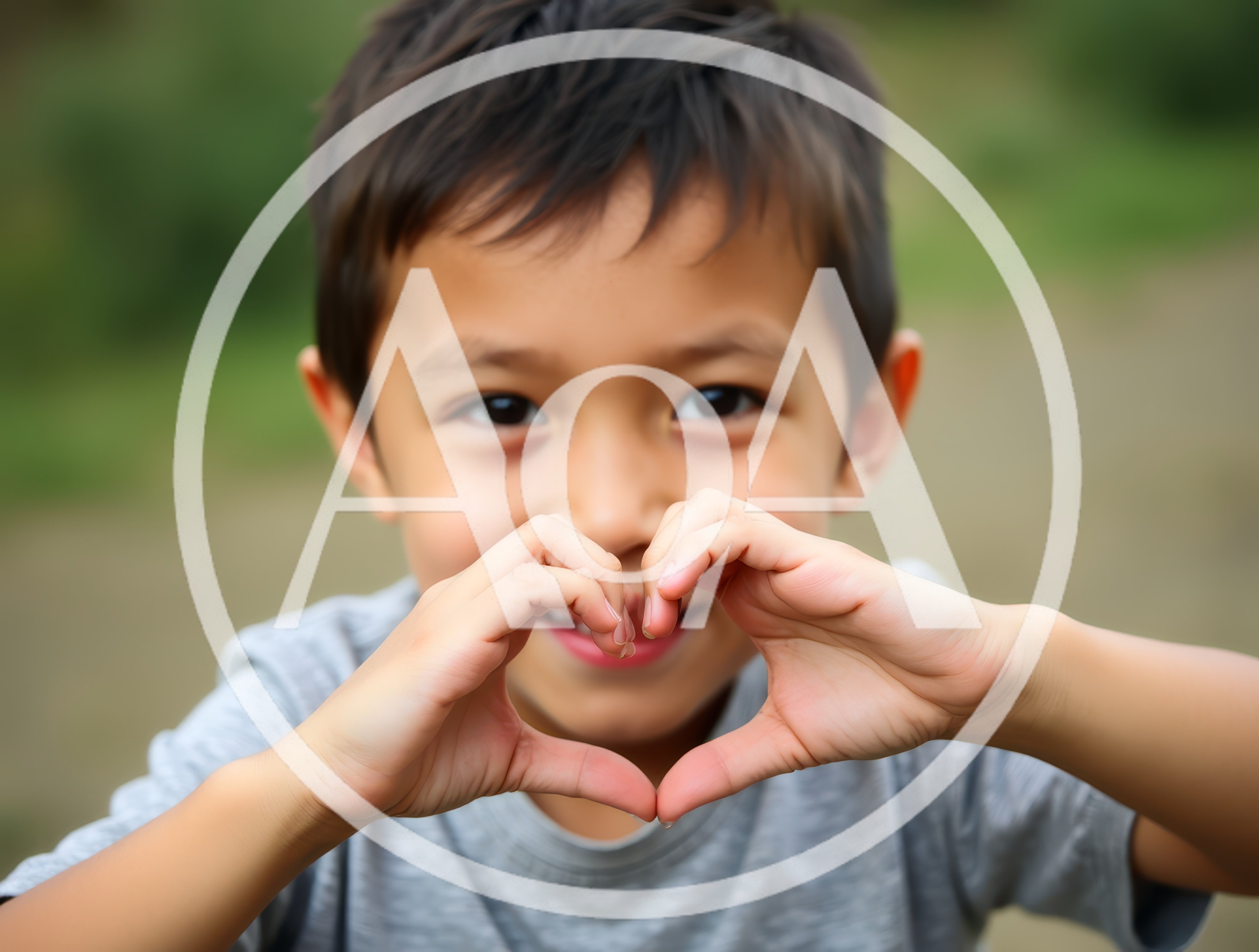 Young Boy Making A Heart Shape With His Hands