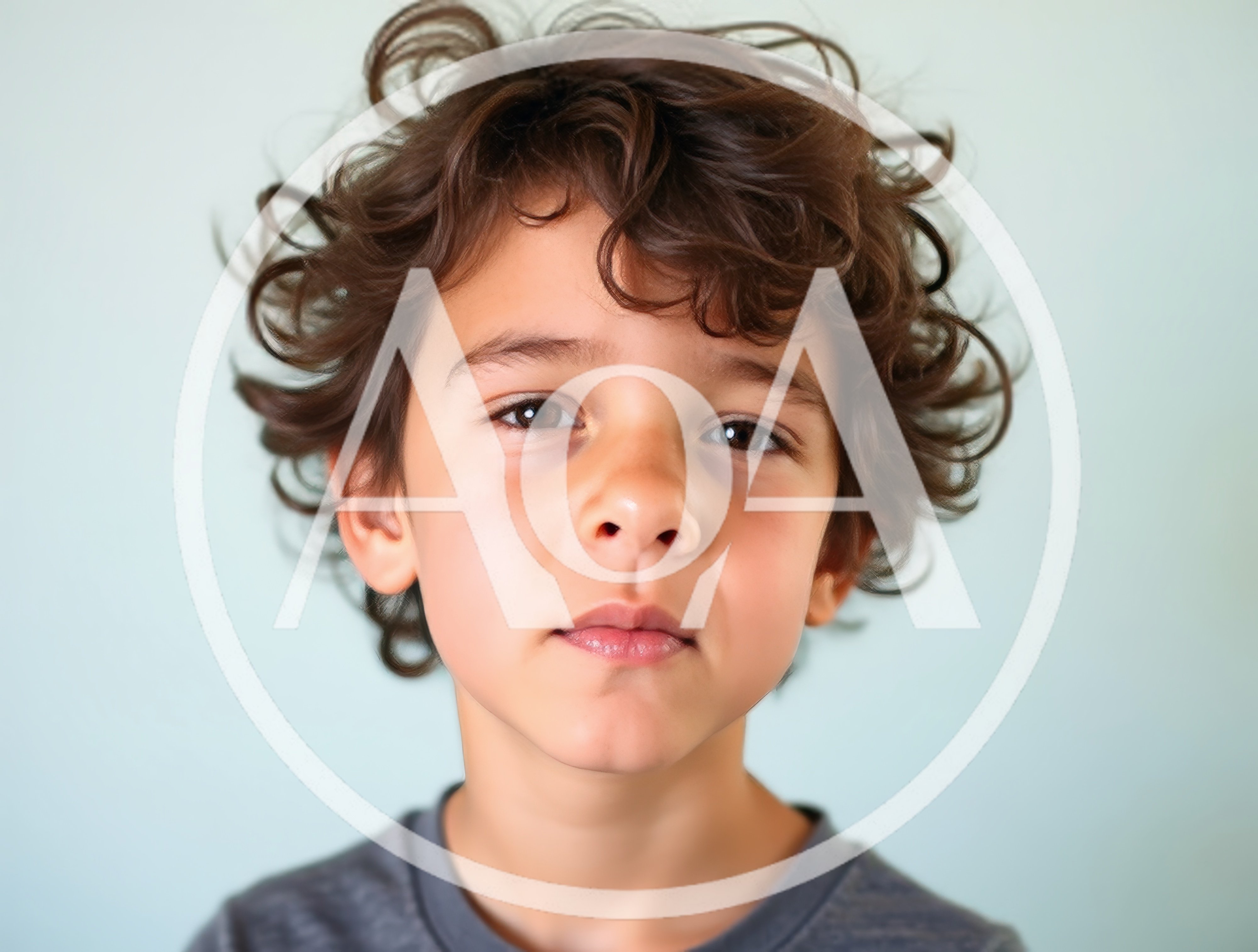 Portrait Of A Young Boy With Curly Hair
