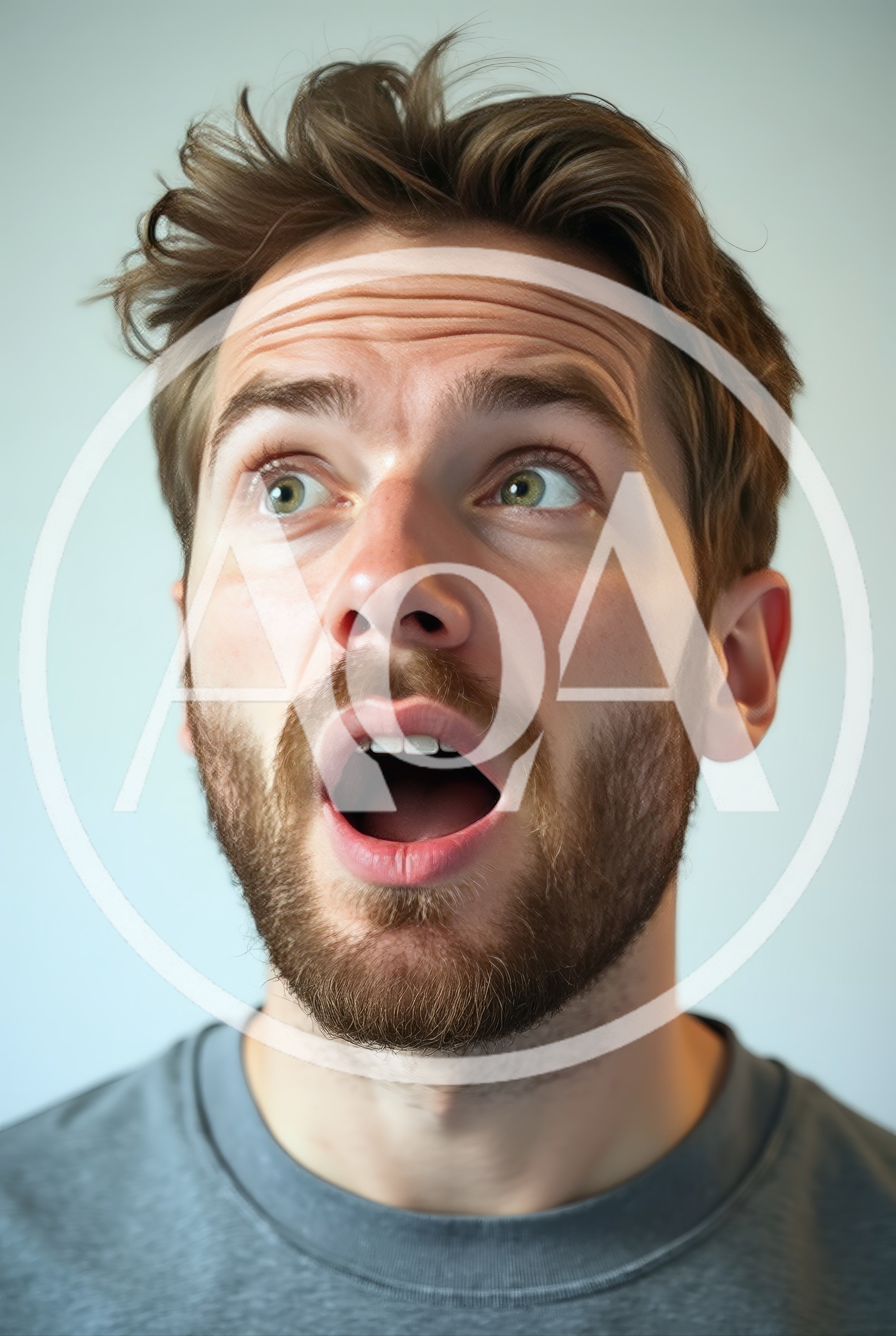 Surprised Young Man With Open Mouth Looking Up