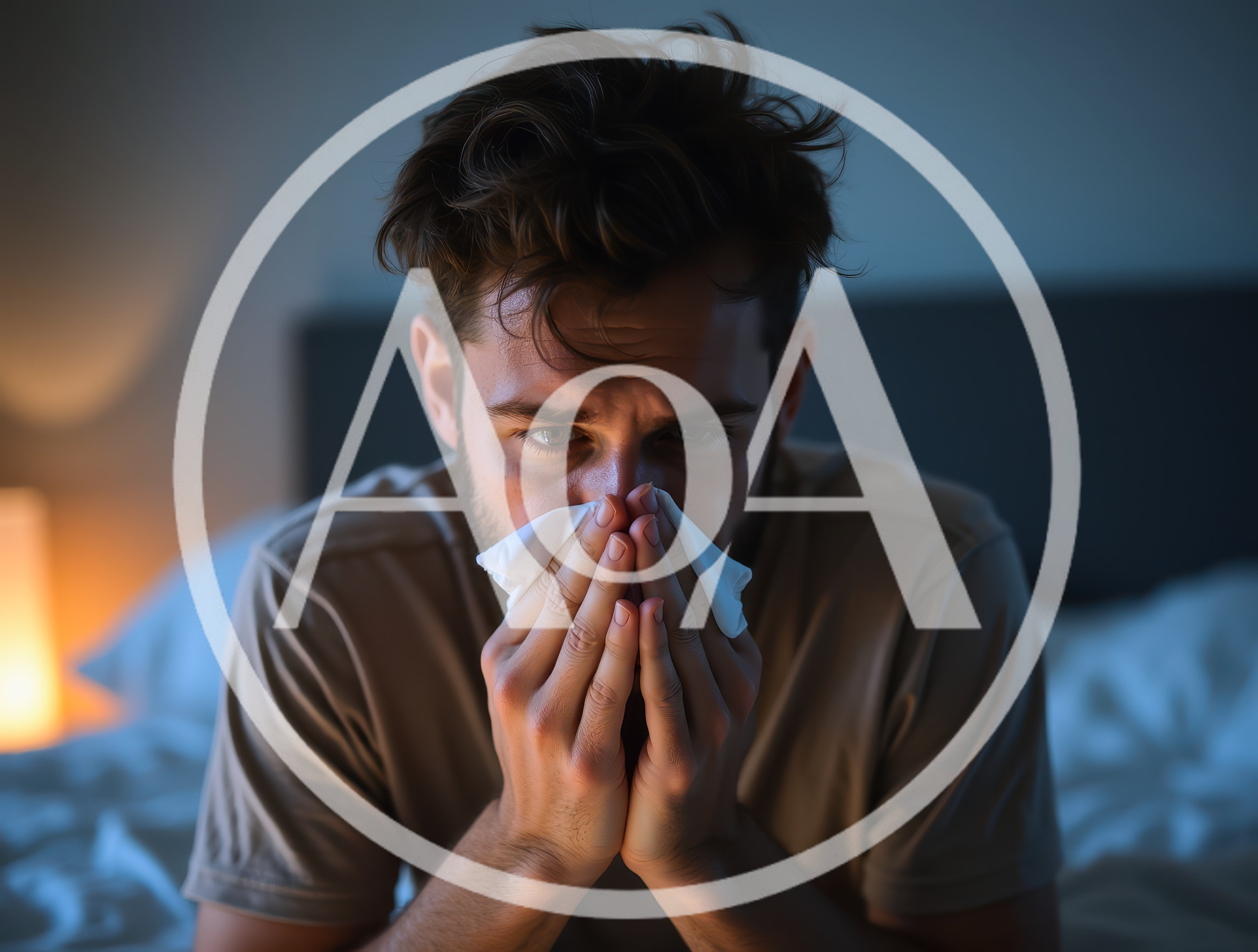 Sick Man Blowing Nose With Tissue In Bed