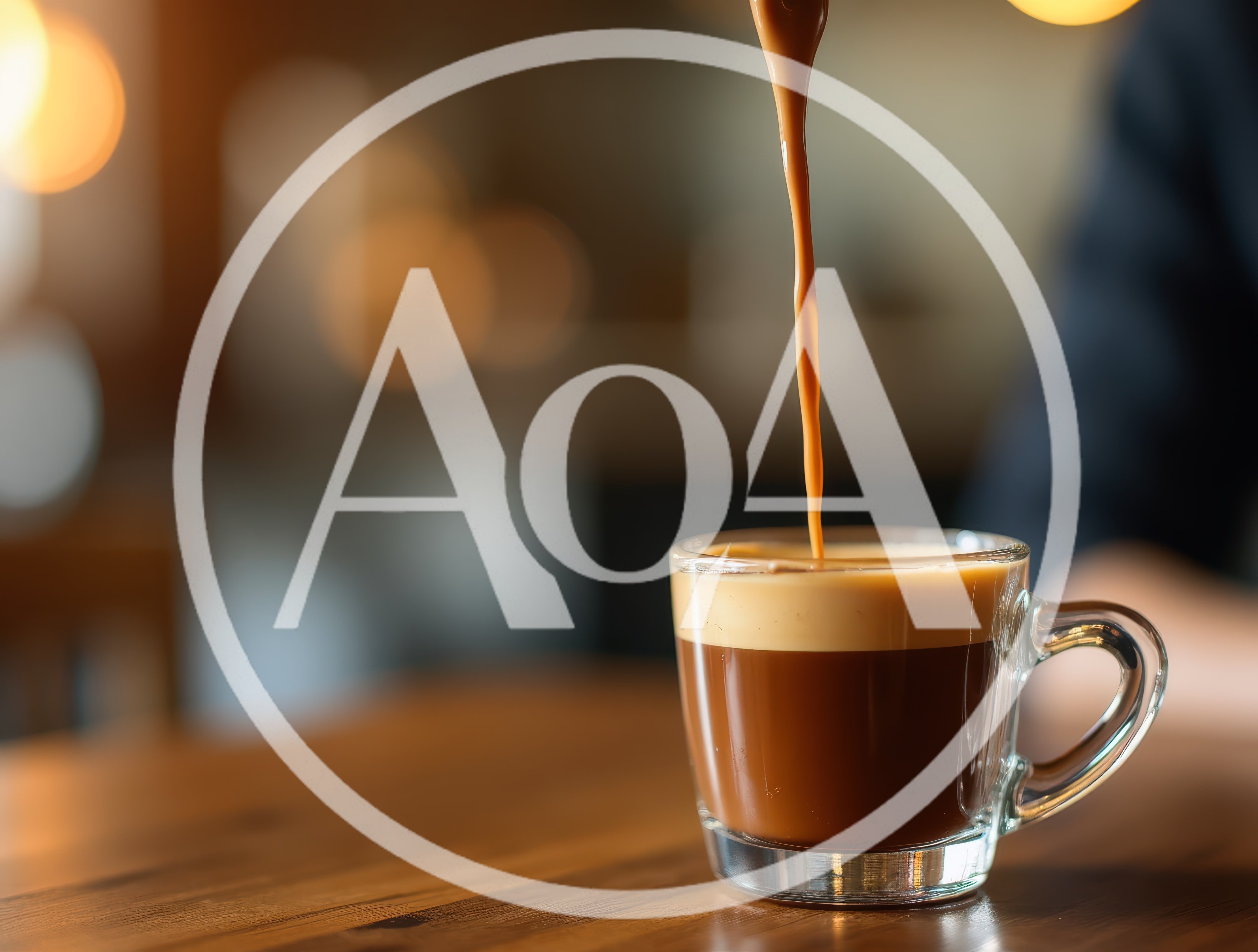 Fresh Coffee Pouring Into A Glass Cup