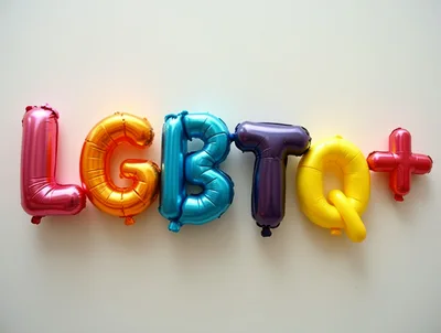 LGBTQ Plus Balloon Letters On White Background