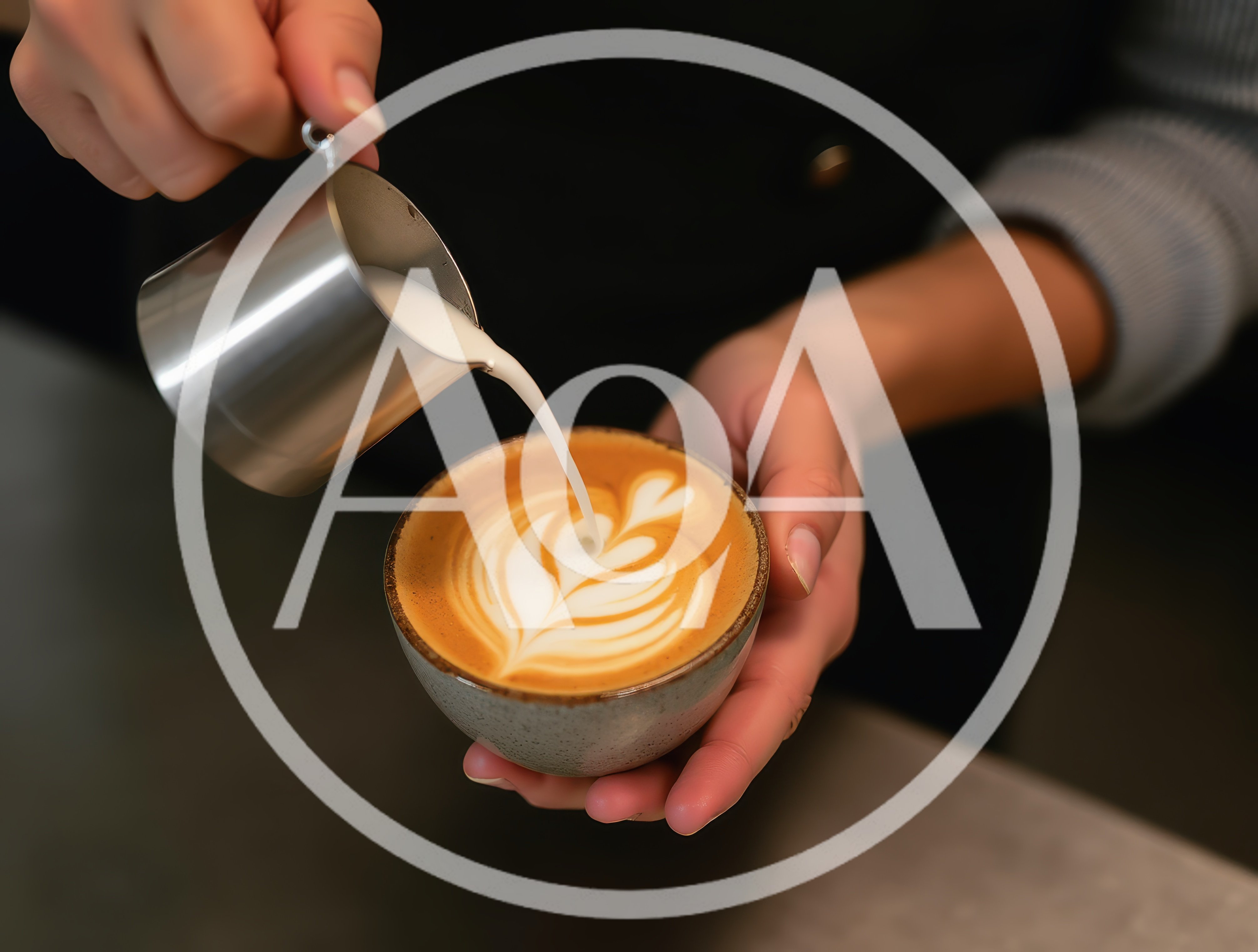 Barista Pouring Steamed Milk Into Latte Art