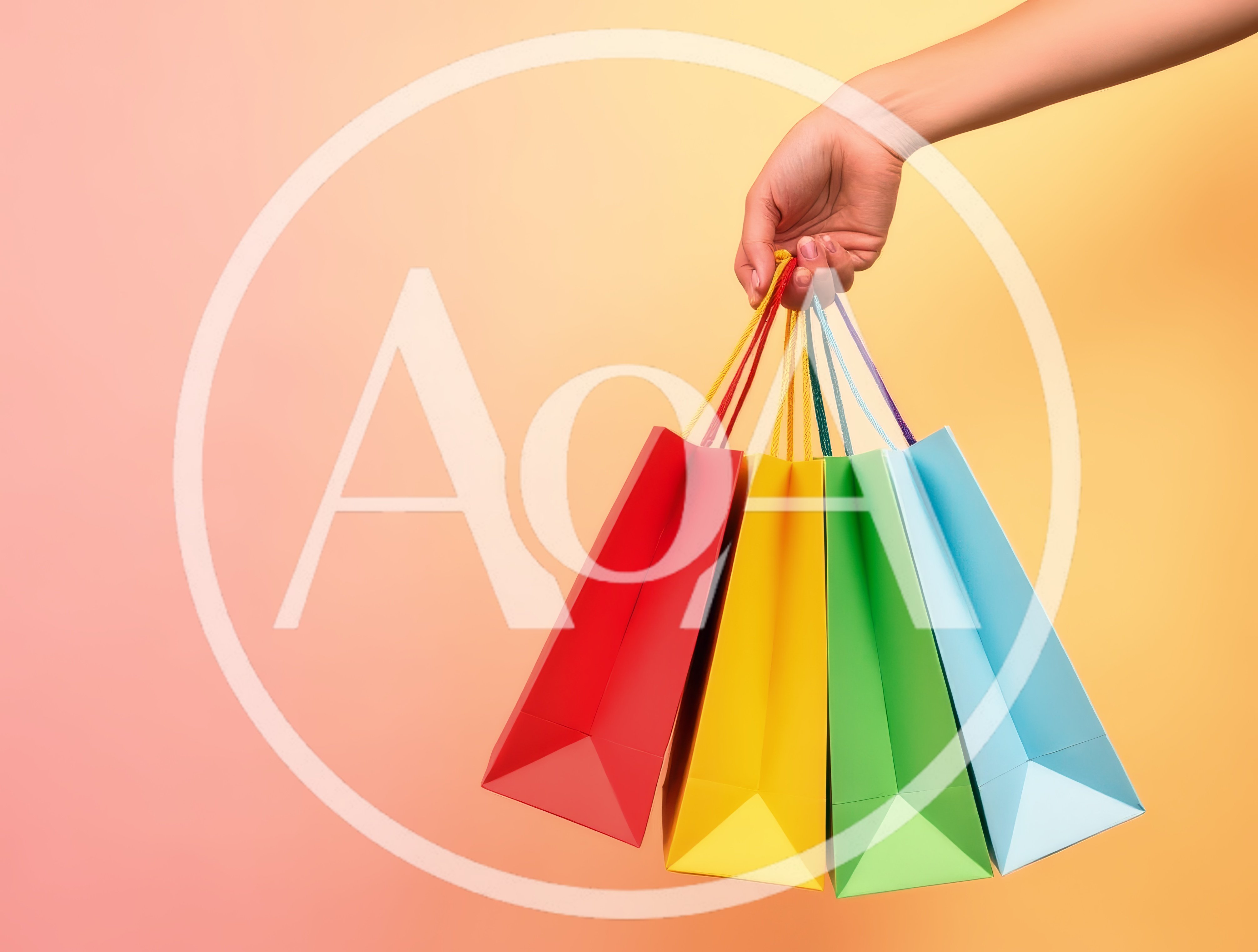 Hand Holding Colorful Shopping Bags Against Gradient Background