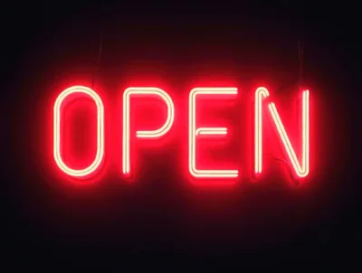 Bright Red Neon Open Sign Glowing In Darkness