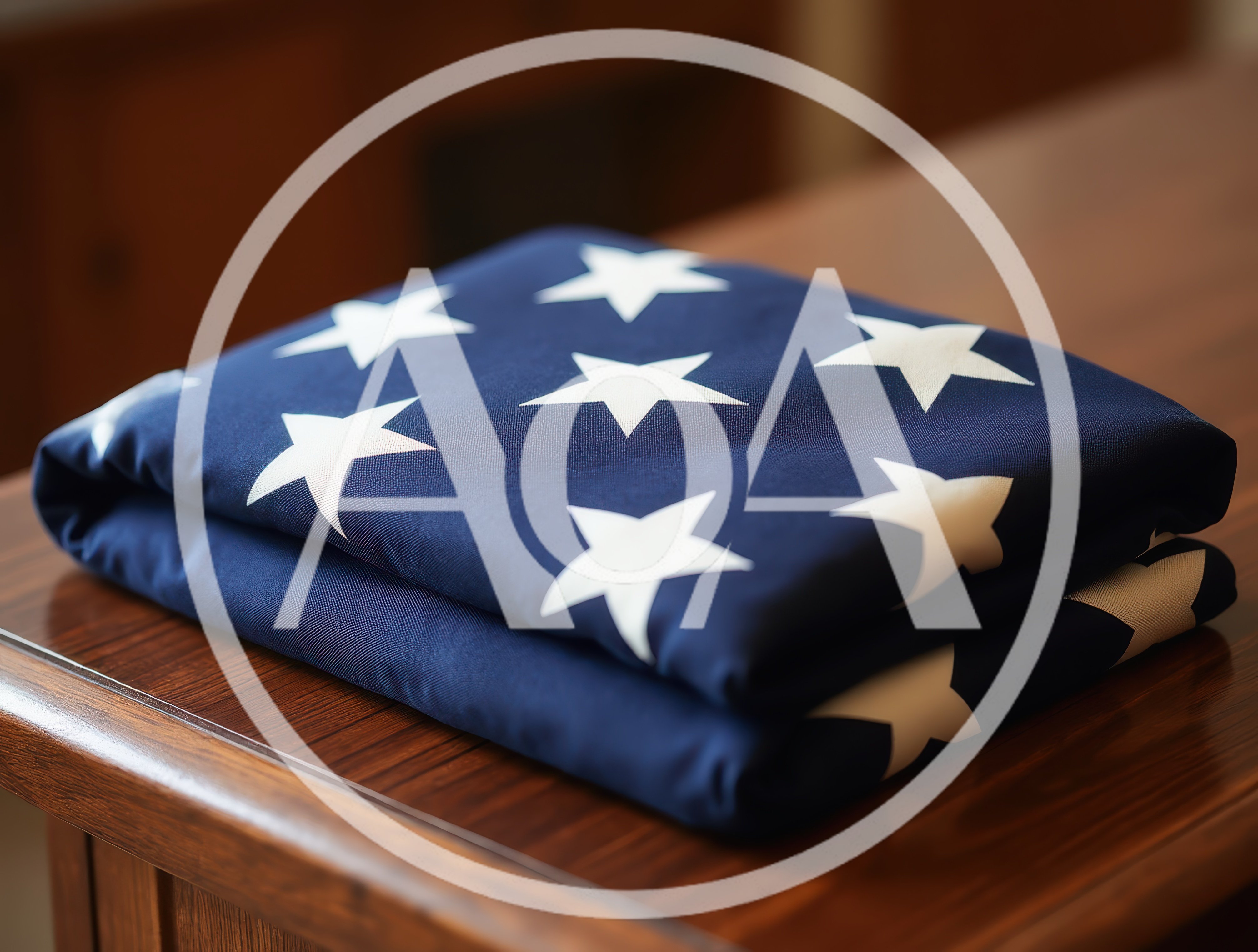 Folded American Flag Resting On A Wooden Table