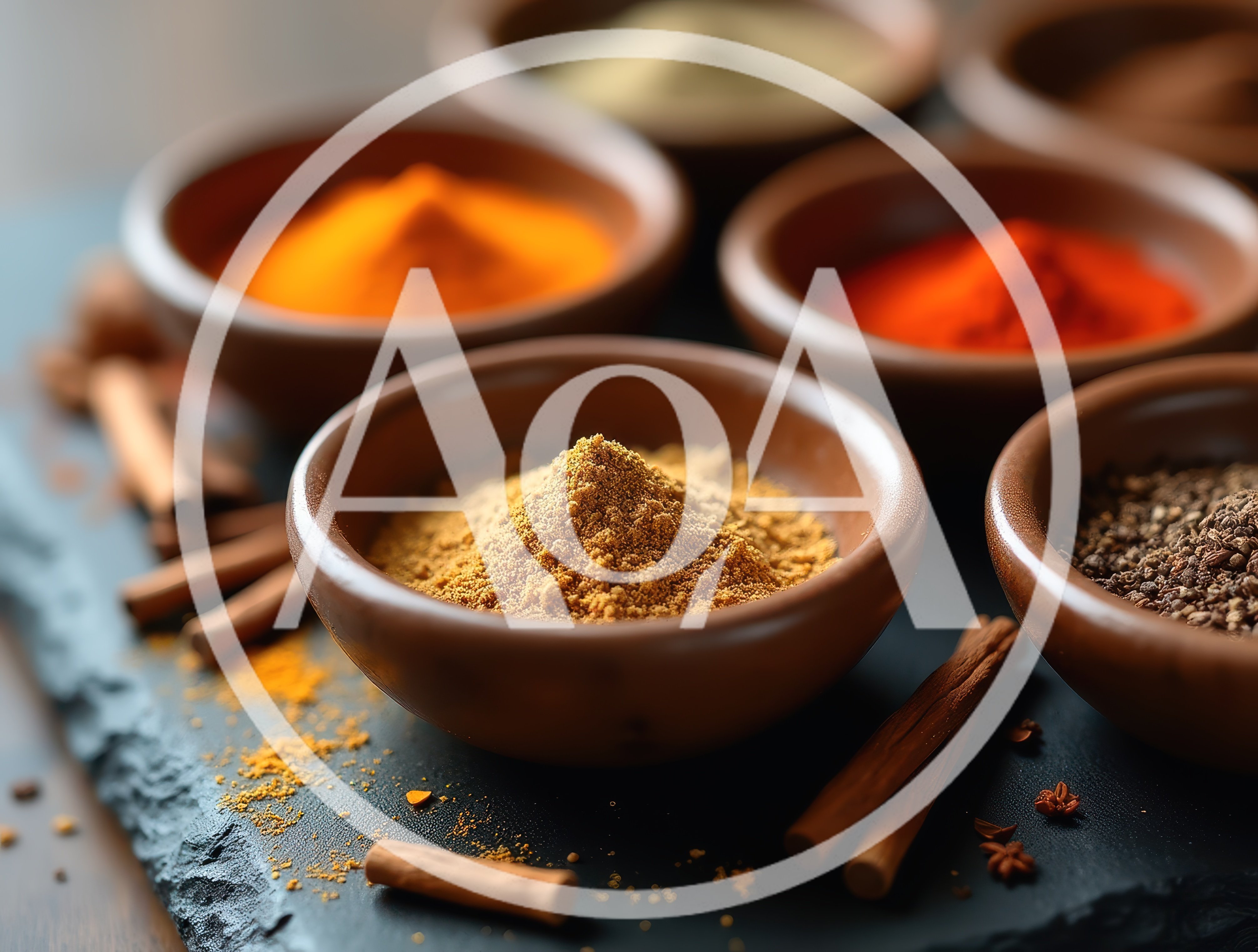 Assorted Spices in Clay Bowls on Slate