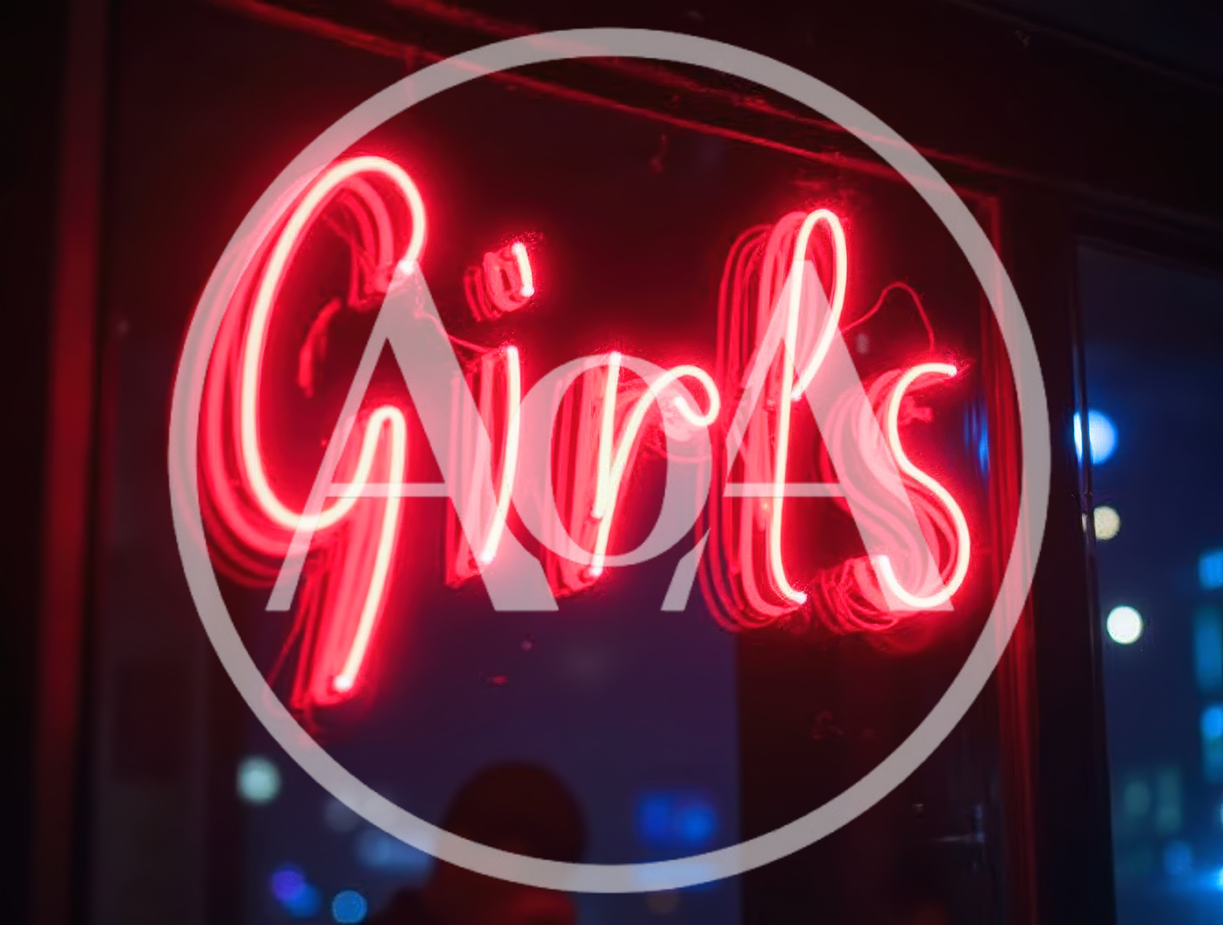 Red Neon Girls Sign Glowing In Night Window