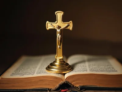 Golden Crucifix Standing On An Open Holy Bible