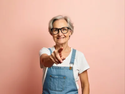 Smiling Senior Woman Pointing Directly At Camera