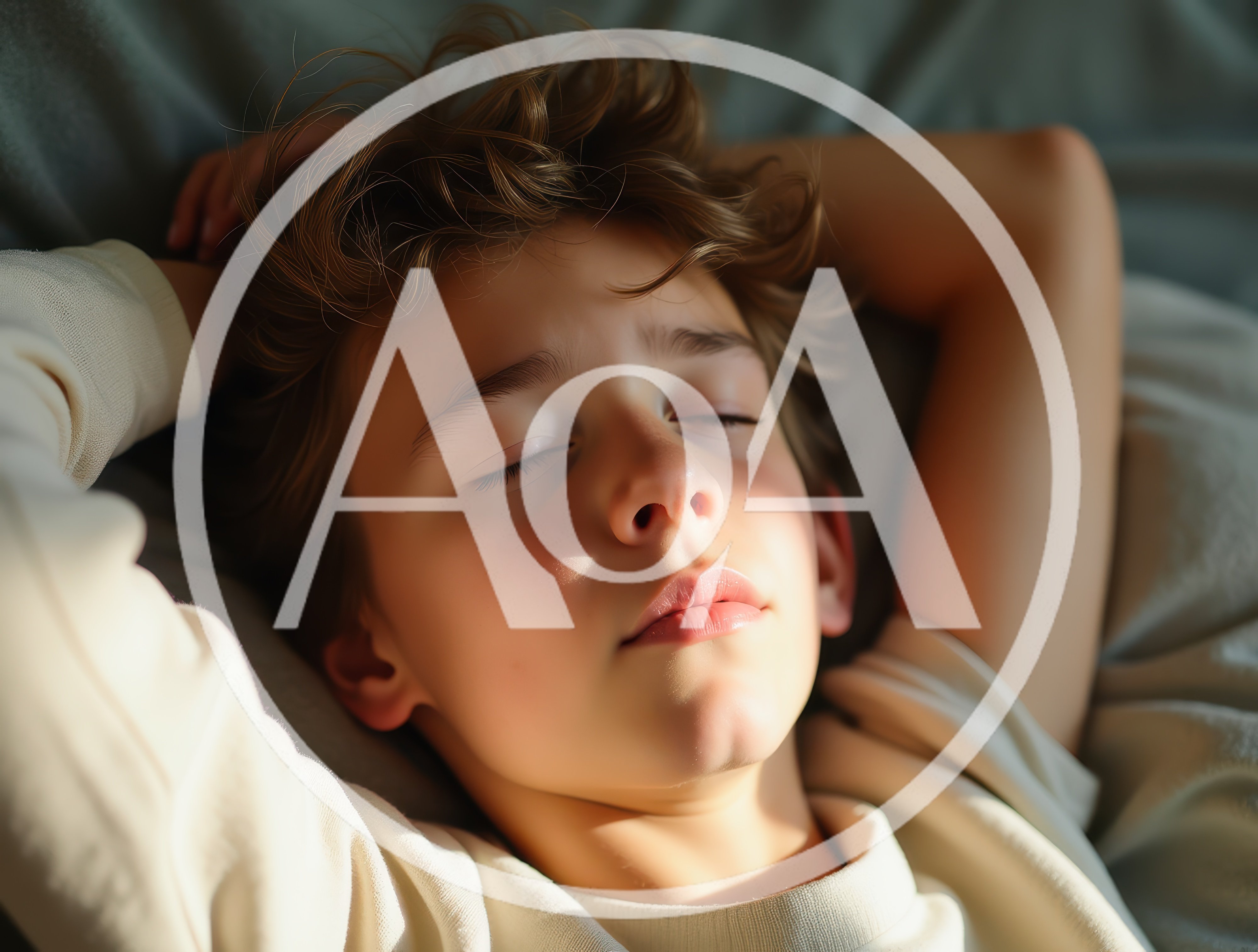 Young Boy Sleeping Peacefully In Bed