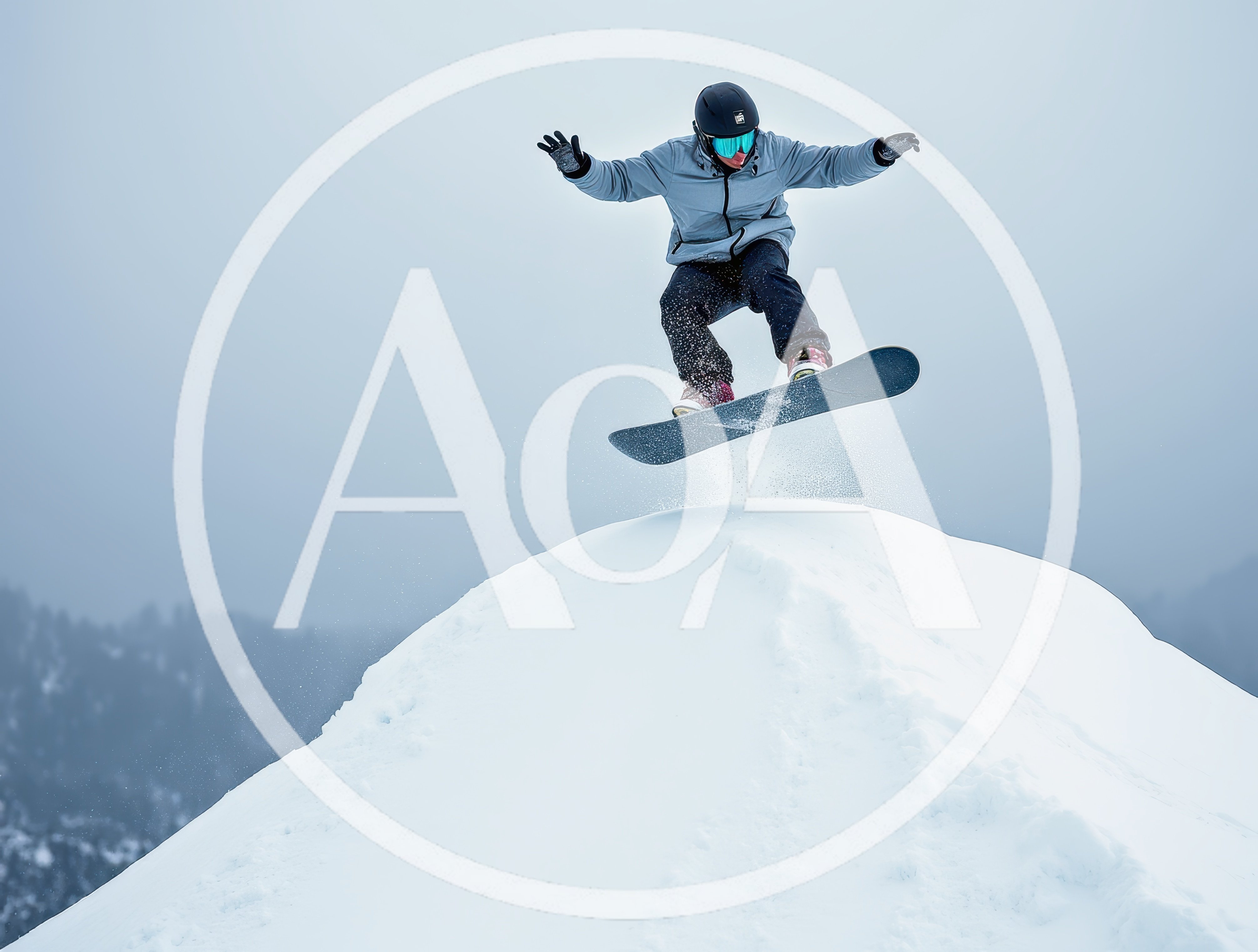 Snowboarder Performing A High Jump Over A Snowy Peak