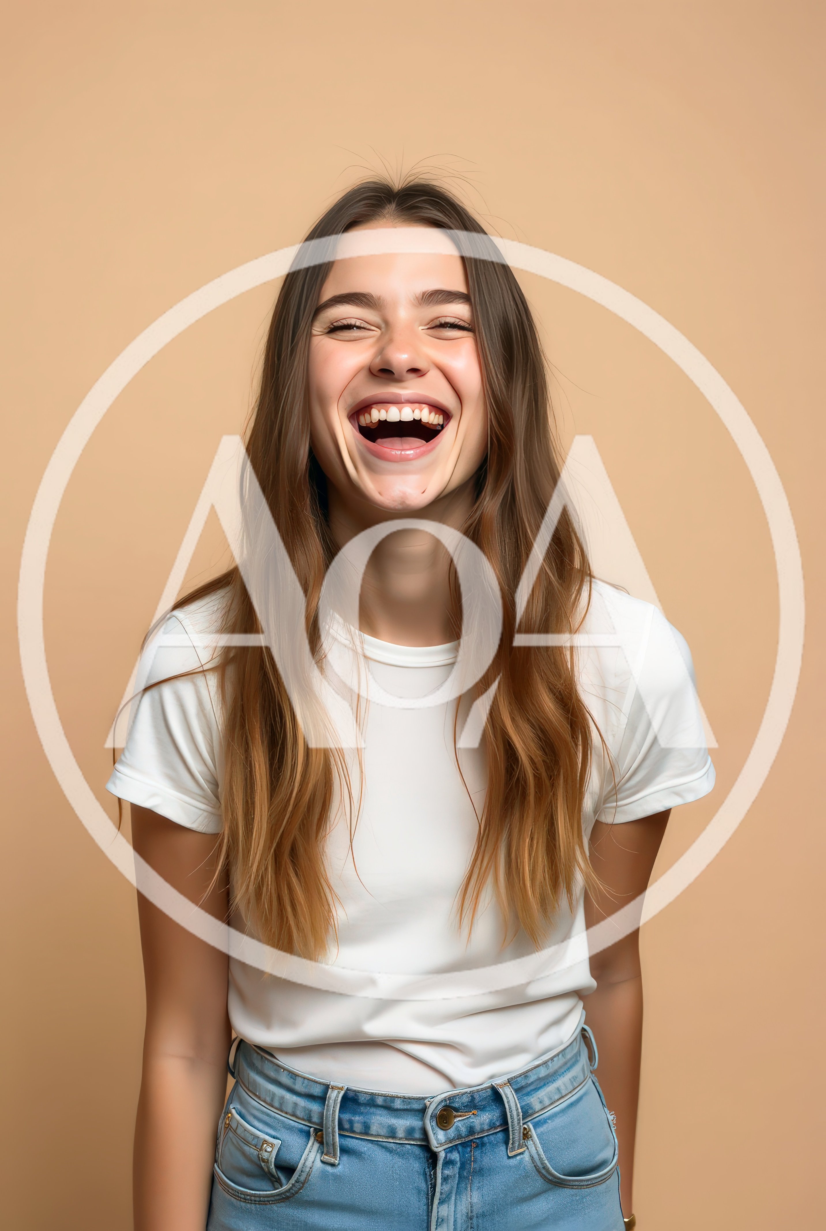 Young Woman Laughing Joyfully Against A Neutral Background