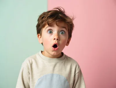 Surprised Young Boy With Wide Eyes And Open Mouth