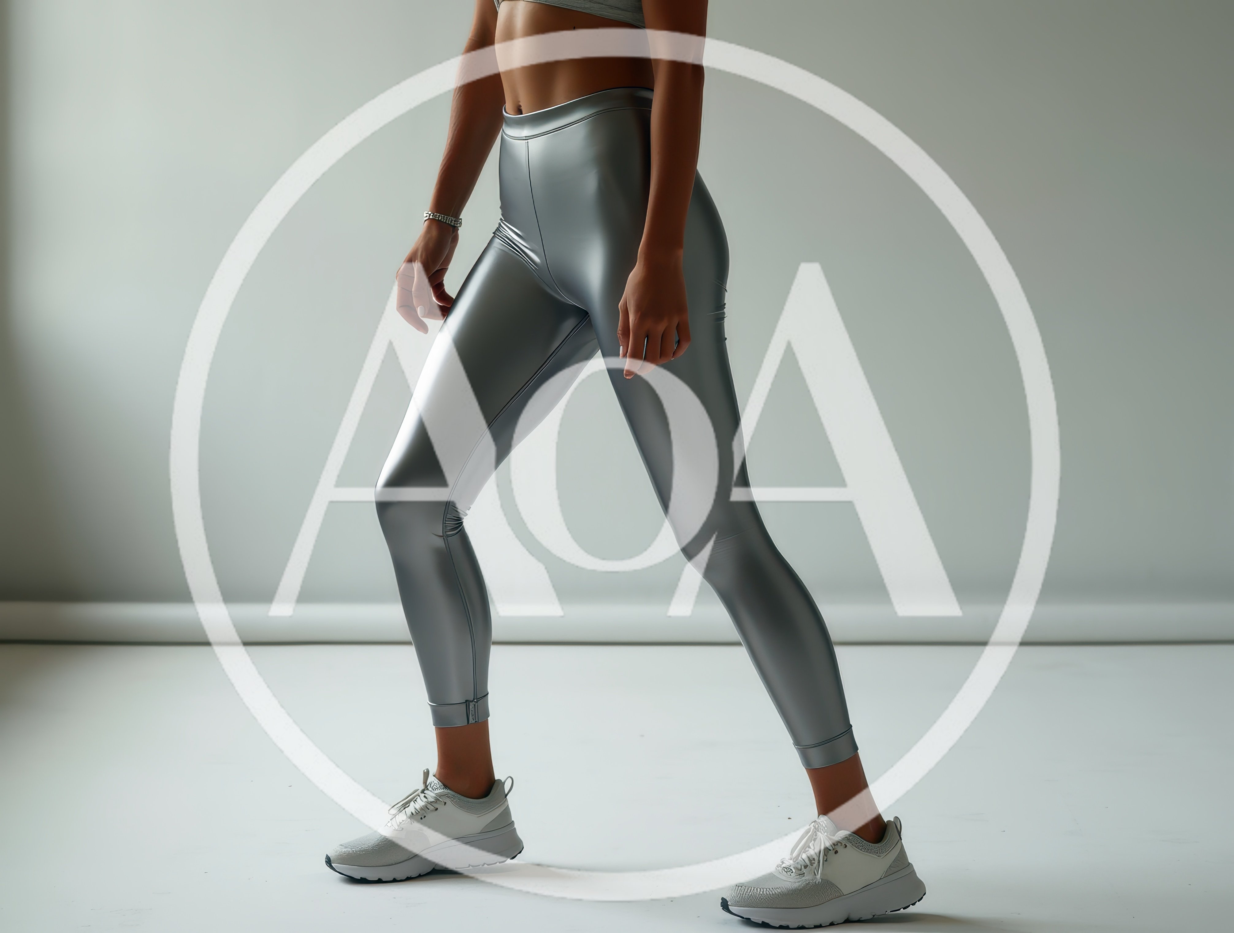 Fit Woman Wearing Metallic Silver Leggings In Studio