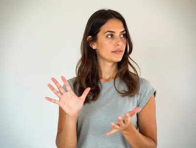 Young Woman Gesturing With Hands In Studio