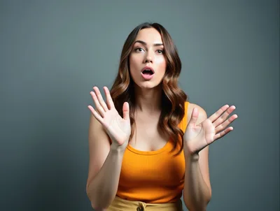 Surprised Young Woman With Open Mouth And Raised Hands