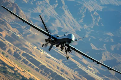 MQ-9 Reaper Drone Flying Over Mountainous Terrain