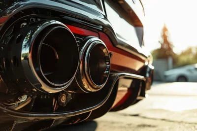 Close Up Of Dual Exhaust Pipes On Sports Car