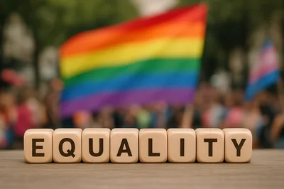 Wooden Blocks Spelling Equality With Pride Flags Background