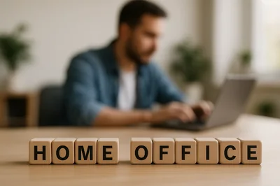 Wooden Blocks Spelling Home Office With Man Working