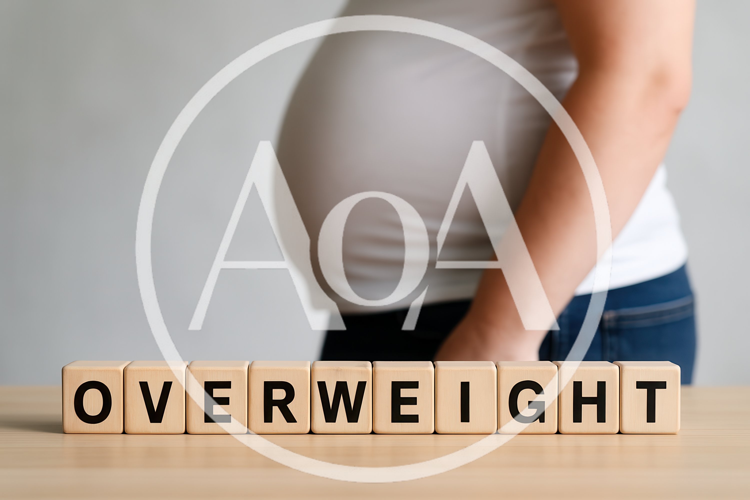 Wooden Blocks Spelling Overweight With Person In Background