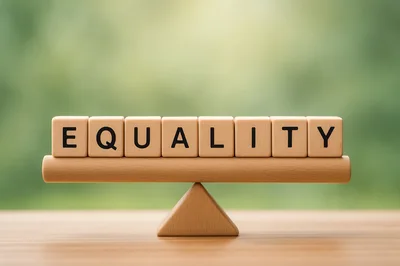 Wooden Blocks Spelling Equality Balanced On A Seesaw