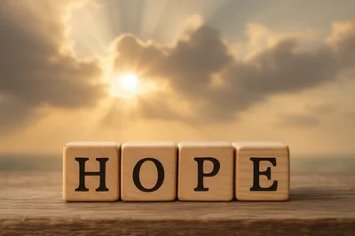Wooden Blocks Spelling Hope Against A Sunset Background