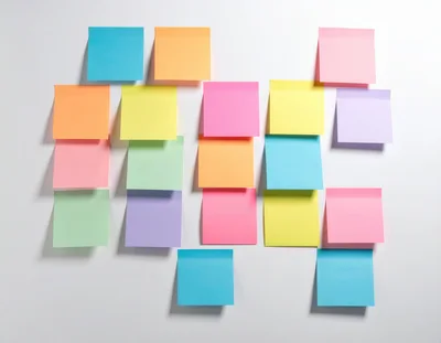 Colorful Sticky Notes Arranged On A White Wall