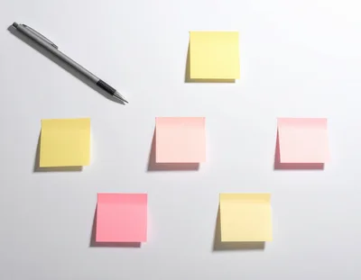 Colorful Sticky Notes Arranged On A White Surface