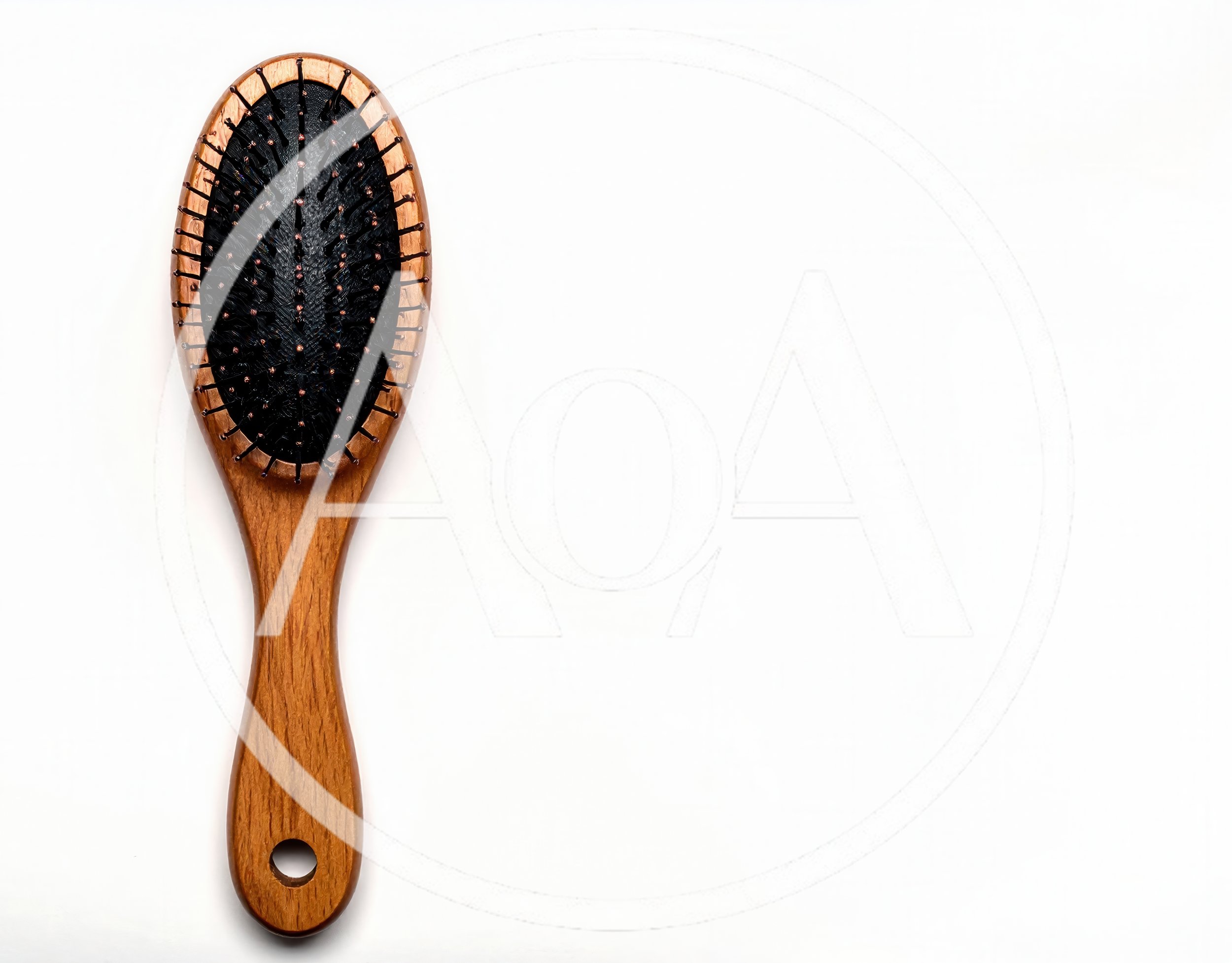Wooden Hairbrush With Black Bristles On White Background