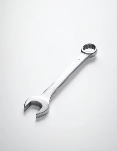Single Chrome Combination Wrench on White Background