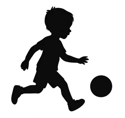 Silhouette Of A Young Boy Playing Soccer